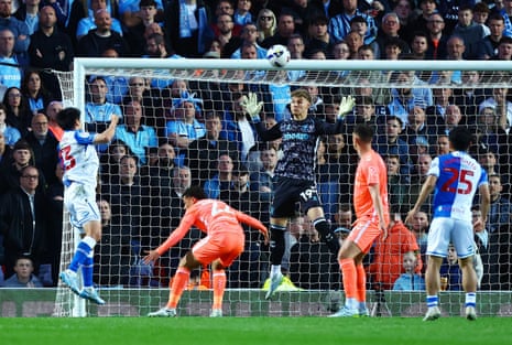 Coventry City keeper Carl Rushworth watches the ball as it goes past him and clatters against the bar.