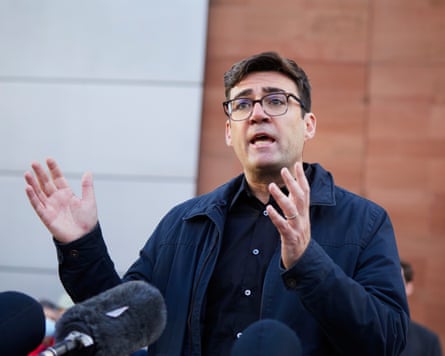Andy Burnham wearing a navy blue jacket and dark shirt