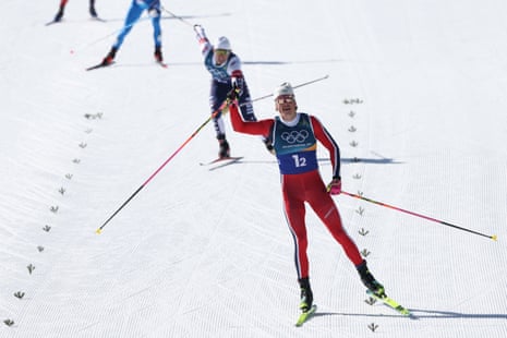 Johannes Høsflot Klæbo crossing the finish line to secure gold for Norway in the men’s cross-country team sprint