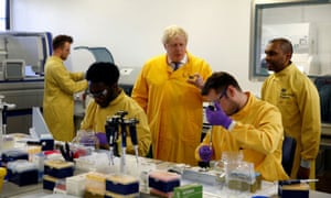 Boris Johnson visits a laboratory at the Public Health England National Infection Service in London in early March.