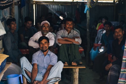 Communal TV viewing allows some in the camps to forget their problems for a while.