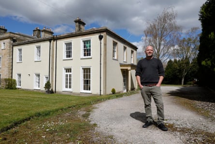 Dunstan Low in front of his six bedroom manor house in Melling, Lancashire.