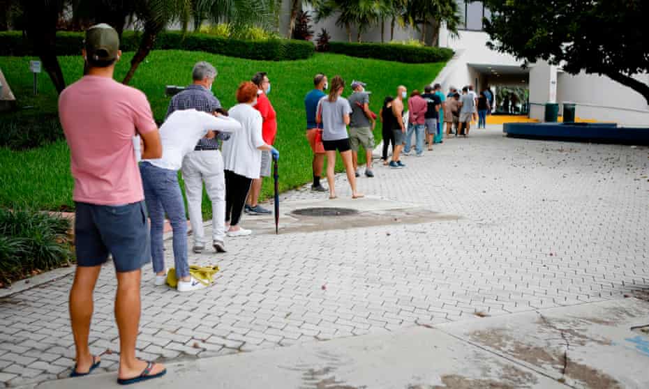 People wait in line to cast early ballots in Miami Beach, Florida, in October 2020. 