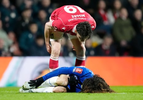 Wrexham's Kieffer Moore (top) stands over Chelsea's Marc Cucurella after he felt that the Chelsea player dived.