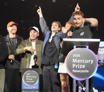 Sam Fender and band celebrate their win.