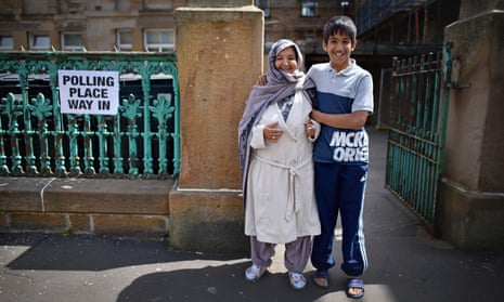 Members of the public at Pollokshields primary school polling station in Glasgow, Scotland.