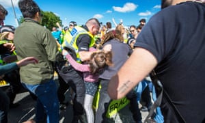 Police with demonstrators at fracking site Preston New Road