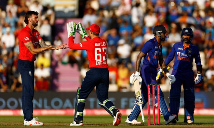 England's Reece Topley celebrates winning the wicket against Indian Hardik Pandya.
