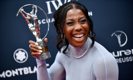 Shelly-Ann Fraser-Pryce shows off her World Sportswoman of the Year prize at the Laureus Sports Awards ceremony in Paris