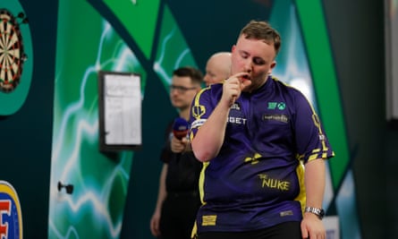 Luke Littler indicates how close he was to a 9 dart finsh