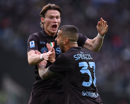 Leonardo Spinazzola celebrates with Scott McTominay after opening the scoring.