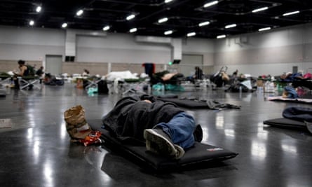 A man sleeps at a cooling shelter set up in Portland, Oregon, on Sunday.