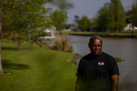 Man stands by water