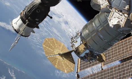 View of the International Space Station with Soyuz module on the left.