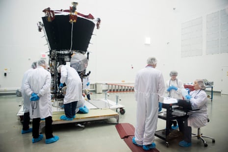 engineers examine the parker solar probe in a nasa lab in greenbelt maryland