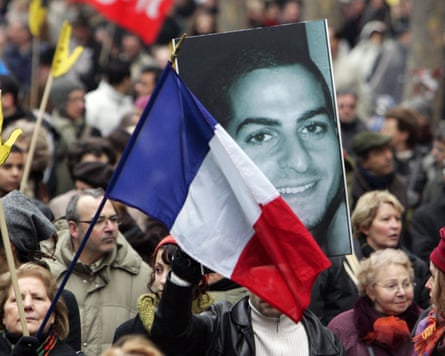 Marchers with a portrait of Ilan Halimi and a French flag