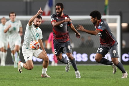 New Zealand’s Kosta Barbarouses (left) is challenged by New Caledonia’s Fonzy Ranchain (centre) and Joseph Athale.