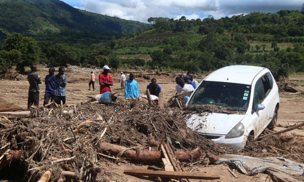 Survivors of Cyclone Idai inspect flood wreckage in the village of Kopa, Zimbabwe, on Thursday.