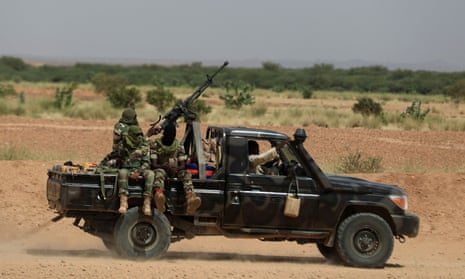 Nigerien soldiers riding a truck outside Agadez