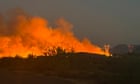 Firefighters near Phoenix battle wildfire as temperatures surpass 100F