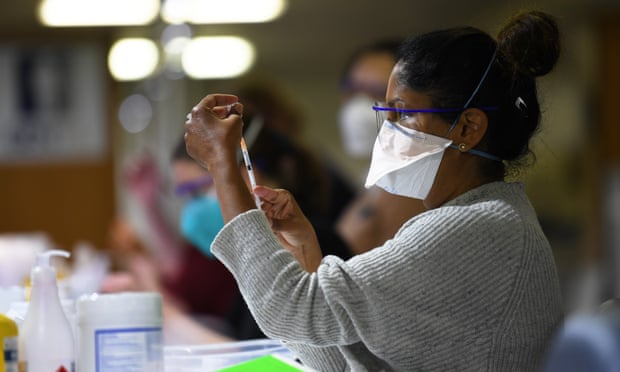 A healthcare worker prepares Covid-19 vaccinations at the vaccination centre at Sandown Racecourse in Melbourne