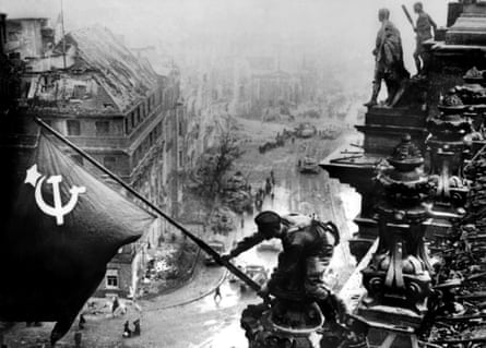 Yevgeny Khaldei’s photo of Soviet soldiers raising a flag on top of the Reichstag, which was staged.