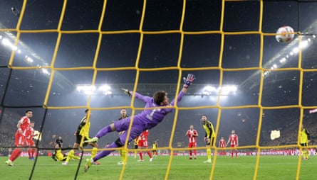 Joshua Kimmich (second left) watches his sublime volley sail past Gregor Kobel to win the game for Bayern Munich