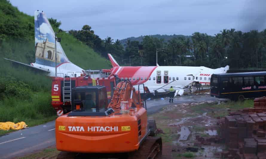 The wreckage of the Air India Express jet, at the foot of the elevated runway at Calicut international airport.