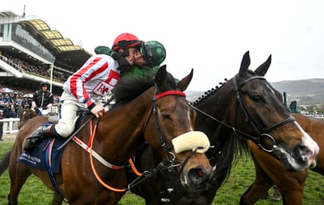 Sam Twiston-Davies gets a kiss from Daryl Jacob on Bronn after his victory on The Real Whacker.