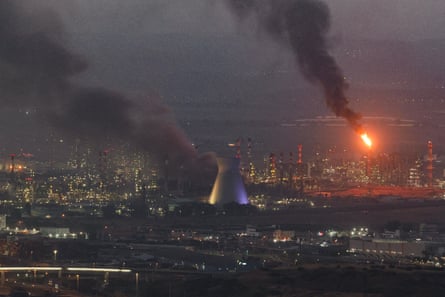 Smoke billows from a site in the city of Haifa on Monday after a fresh barrage of Iranian missiles.