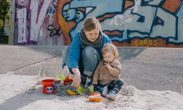 A mother playing with her daughter at a public playground at Nørrebro, Copenhagen.