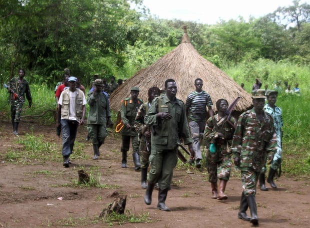 Lord’s Resistance Army fighters emerge from thick bush in Ri-Kwangba on southern Sudan’s border with the Democratic Republic of Congo, in September 2008.