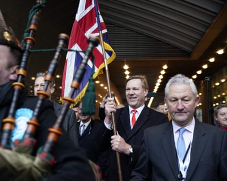 Jonathan Bullock (centre) leaving the European parliament holding a union jack on 31 January 2020.