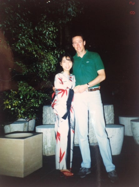 Hitomi and Kerry Cox in Tokyo circa 1990. Hitomi is wearing a white and red robe, and Kerry is wearing a green shirt with beige pants.