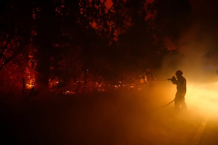 A firefighter battles flames in Cap-Ferret.