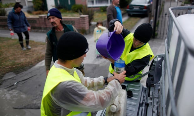 Volunteers distribute clean water to residents following the Christchurch earthquake.