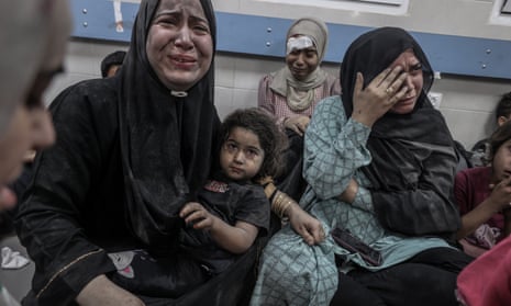 Injured Palestinians taken to Al-Shifa hospital following airstrike on Gaza City hospital.