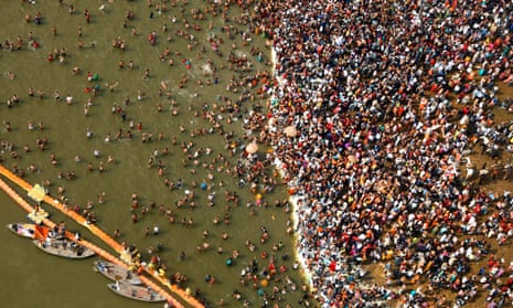 Hindu devotees take dips at Sangam, the confluence of the Yamuna and the Ganges rivers, on Mauni Amavsya, the most auspicious day of Kumbh Mela.