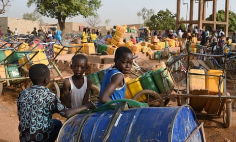 Children wait for their turn to buy water in Ouagadougou, Burkina Faso