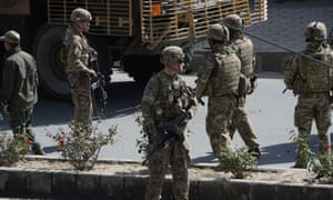 US soldiers arrive at the scene of a suicide car bomb attack on 11 October that targeted foreign military vehicles at Jo-e-Sher in Kabul, Afghanistan.