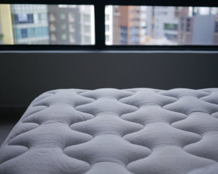 New mattress placed near window in urban apartment