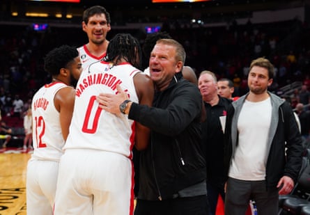 Members of the Houston Rockets hug the NBA team’s owner, Tilman Fertitta, after the game against the San Antonio Spurs at Toyota Center inn October 2022 in Houston, Texas