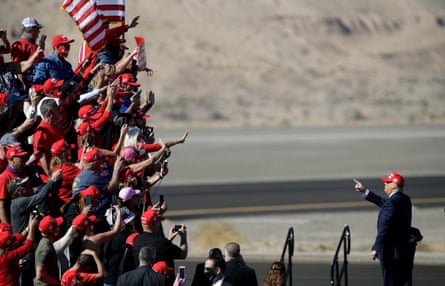 Donald Trump gestures to supporters after a rally in Bullhead City, Arizona, on 28 October.