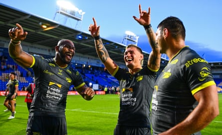 Maika Sivo, Danny Levi and Ryan Hall celebrate after Leeds’ victory against Warrington.