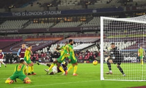 West Ham United’s Michail Antonio (centre, on ground) watches as his shot heads goalwards.