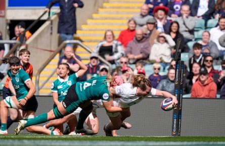 Sarah Bern dives over in the corner despite an Ireland tackler for England’s third try.