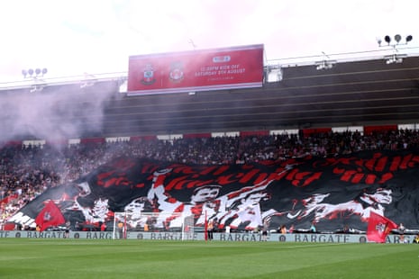A general view of a large banner of former Saints players being presented by Southampton fans.