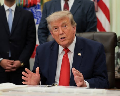 Donald Trump makes an announcement about a $22bn renovation of Washington Dulles international airport in the Oval Office.
