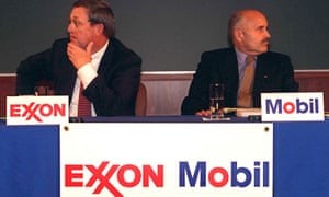 Lee Raymond, chairman of Exxon Corp., left, and Lucio Noto, chairman of Mobil Corp., look in opposite directions during the news conference to announce the merger of their companies Tuesday, Dec. 1, 1998, in New York.