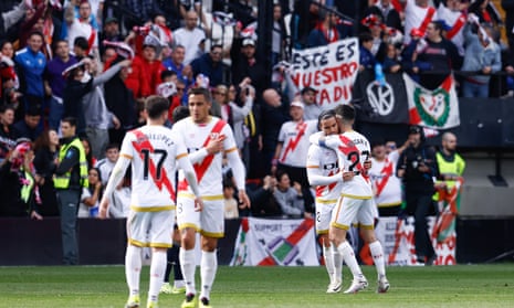 Rayo Vallecano’s players celebrate Raúl de Tomás’s goal to clip Real Madrid wings in the local derby.